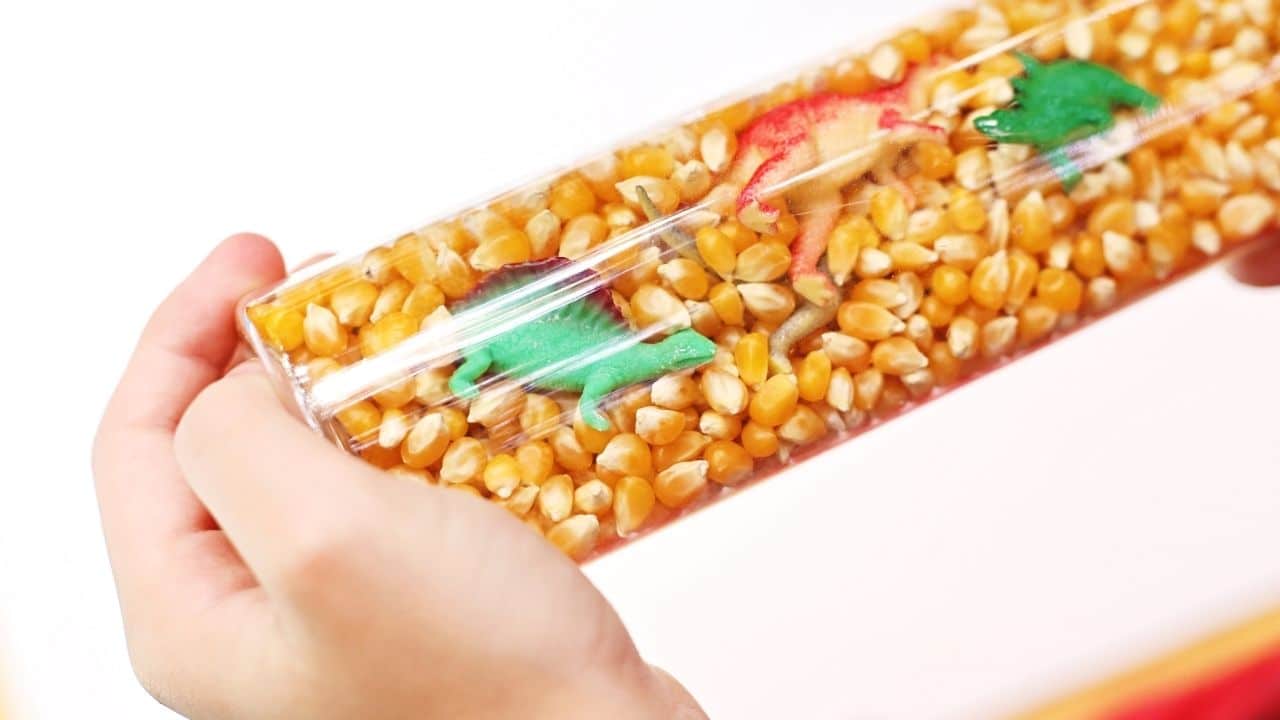 dinosaur sensory bin kids hand hero.